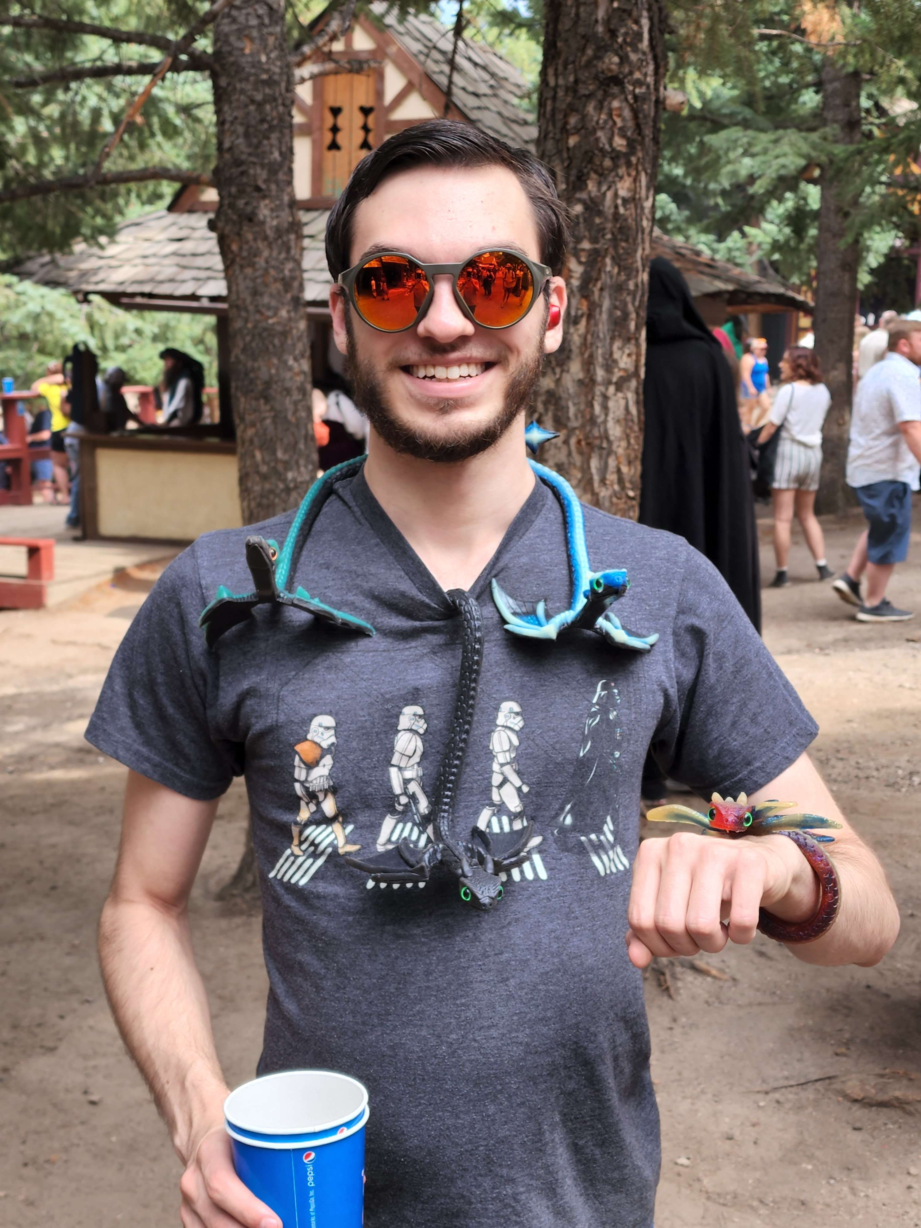 Zachary Shimpa with resin dragons at the renn fair